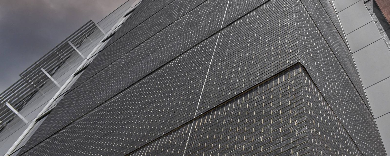 Dark coal-toned face brick in raking light