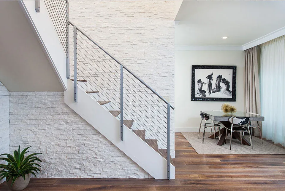 White stone accent wall in a bright interior