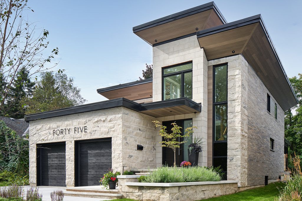 Modern home with full-bed structural stone exterior