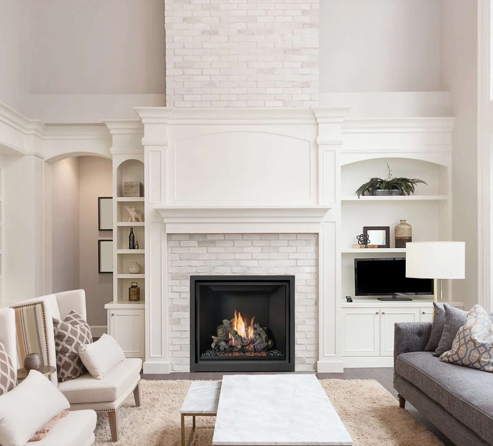 A fireplace and stone surround supplied and installed by Tate Builders Supply